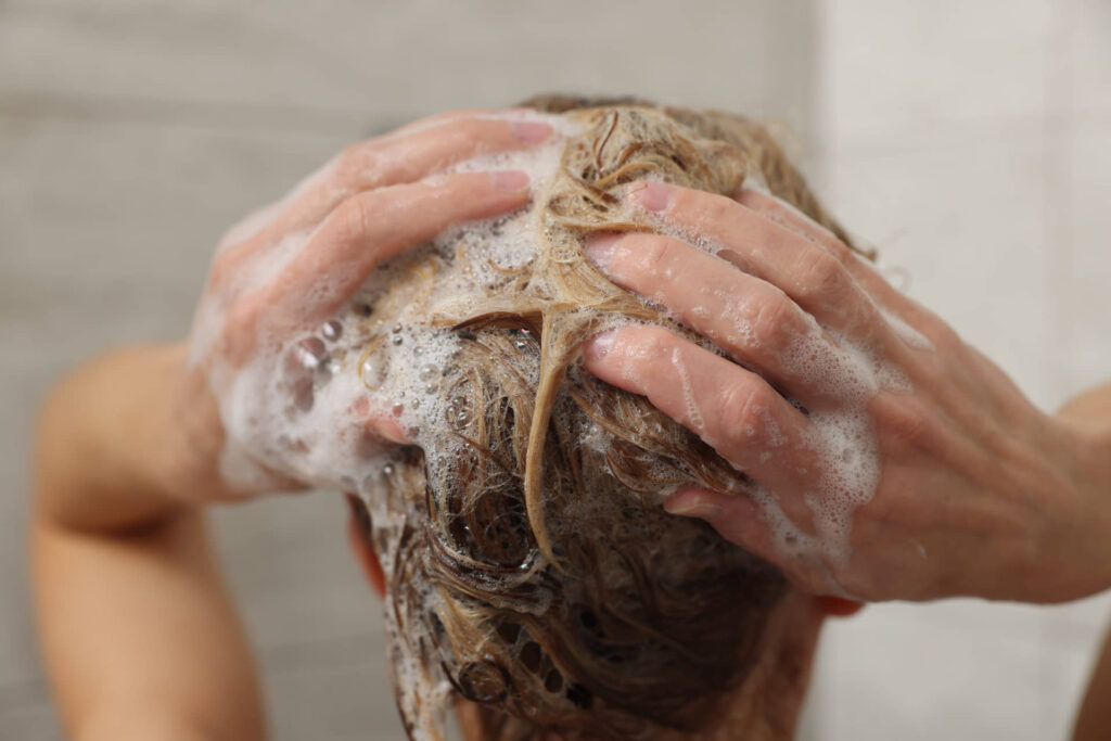 Woman washing her hair in the shower